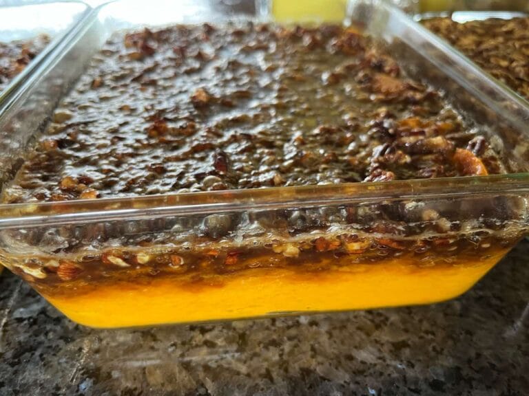Homemade sweet potato casserole topped with toasted pecans and brown sugar..