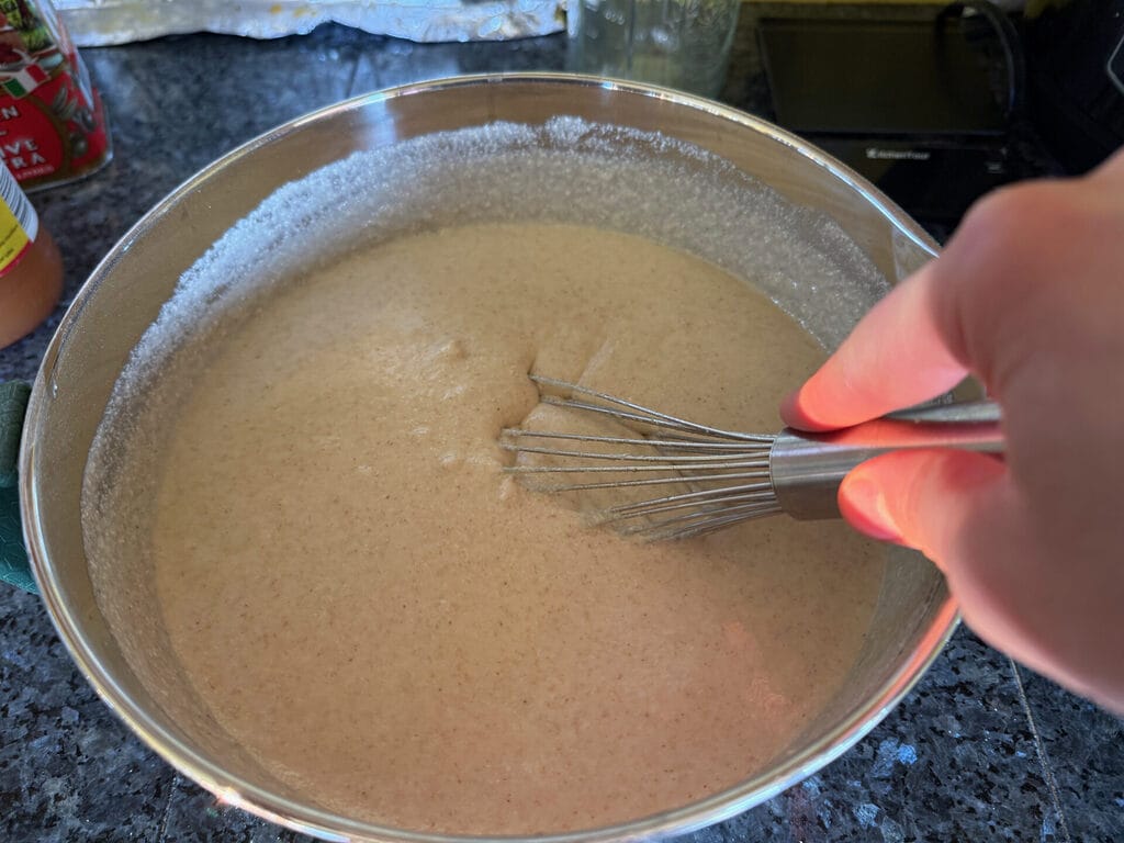 Whisking batter in pot