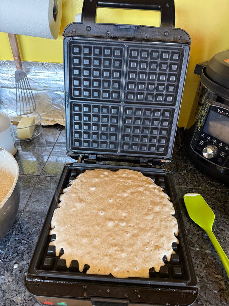 Waffle maker with batter